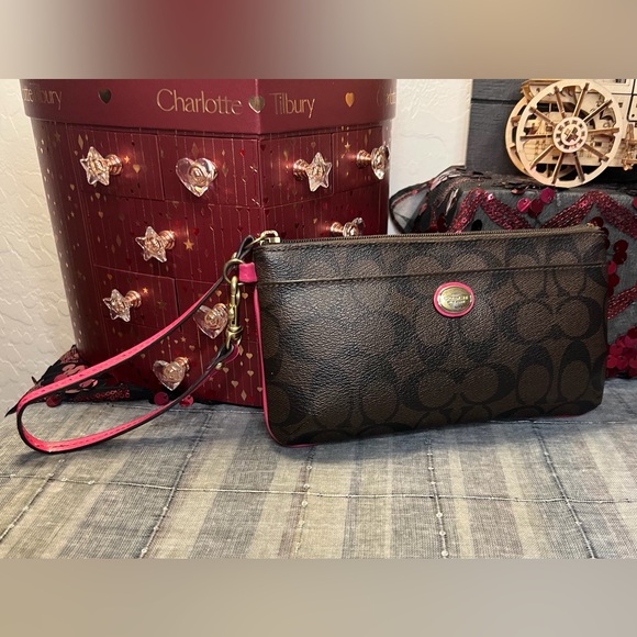 Coach Handbags - Coach Dark Brown Safiano Signature C Wristlet with Pink Trim